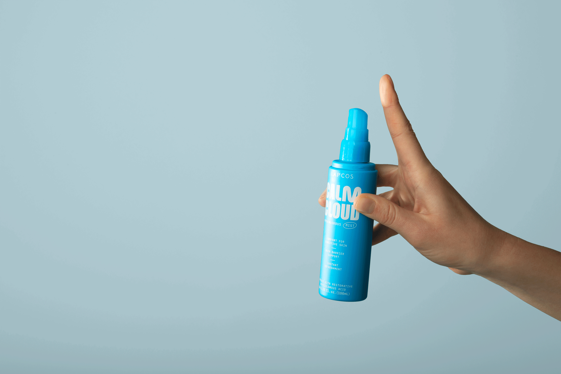 GIF of finger pressing spray pump on LAPCOS Calm Cloud Hypochlorous Acid Spray in blue bottle
