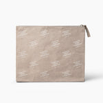 Beige makeup pouch with white text pattern on a white background